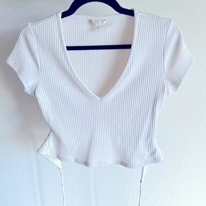 Guess. V neck t-shirt. Ties in the back.